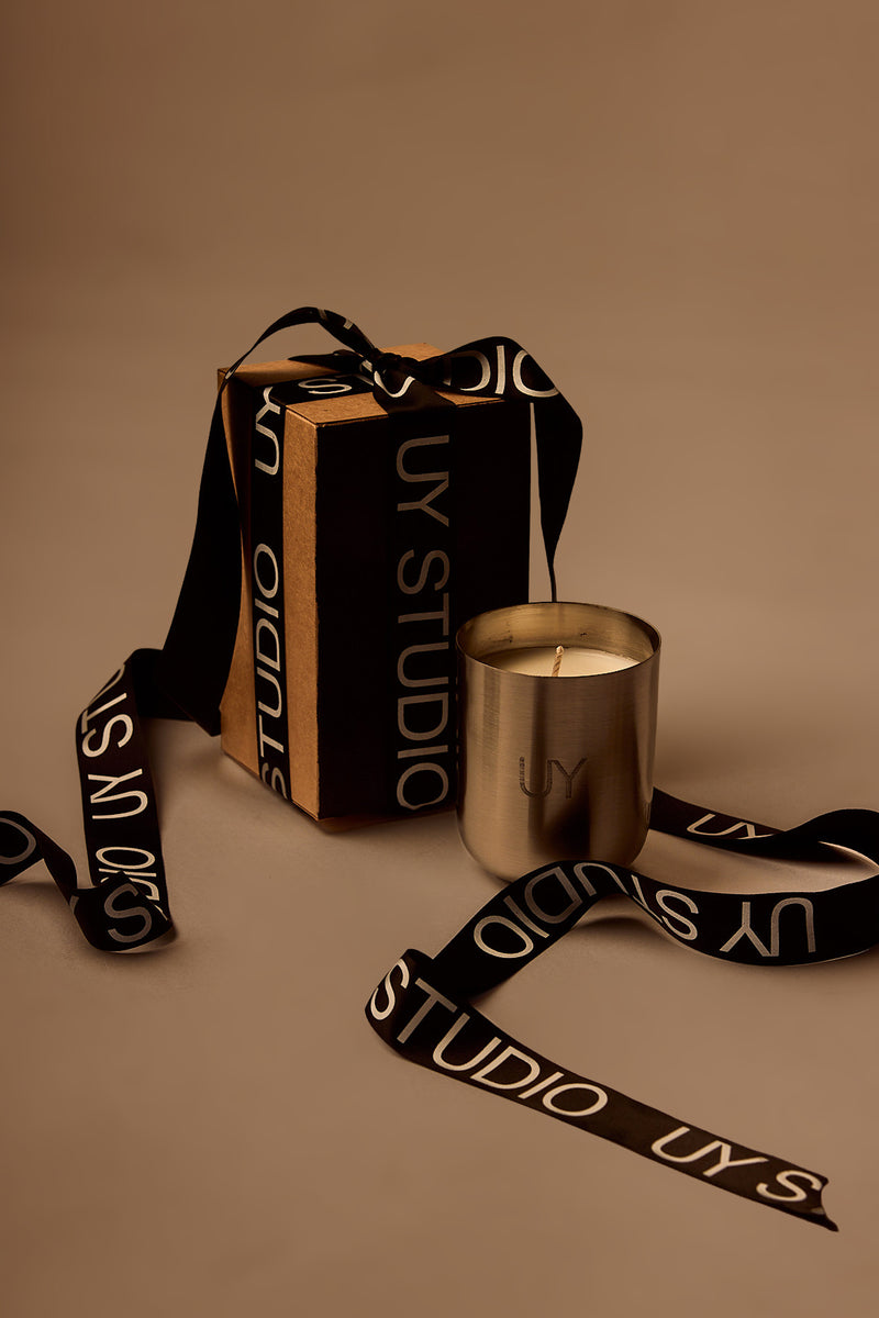 UY Studio U Candle Premium luxury scented candle in a minimalist stainless steel jar, hand-poured in Germany, with rich Oud, Amber, Vanilla and Musk fragrance notes.