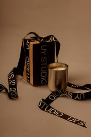 UY Studio X premium scented candle in a steel container, a niche home fragrance from Berlin with notes of patchouli, sandalwood, agarwood and tonka bean. gift wrapping. christmas. xmas