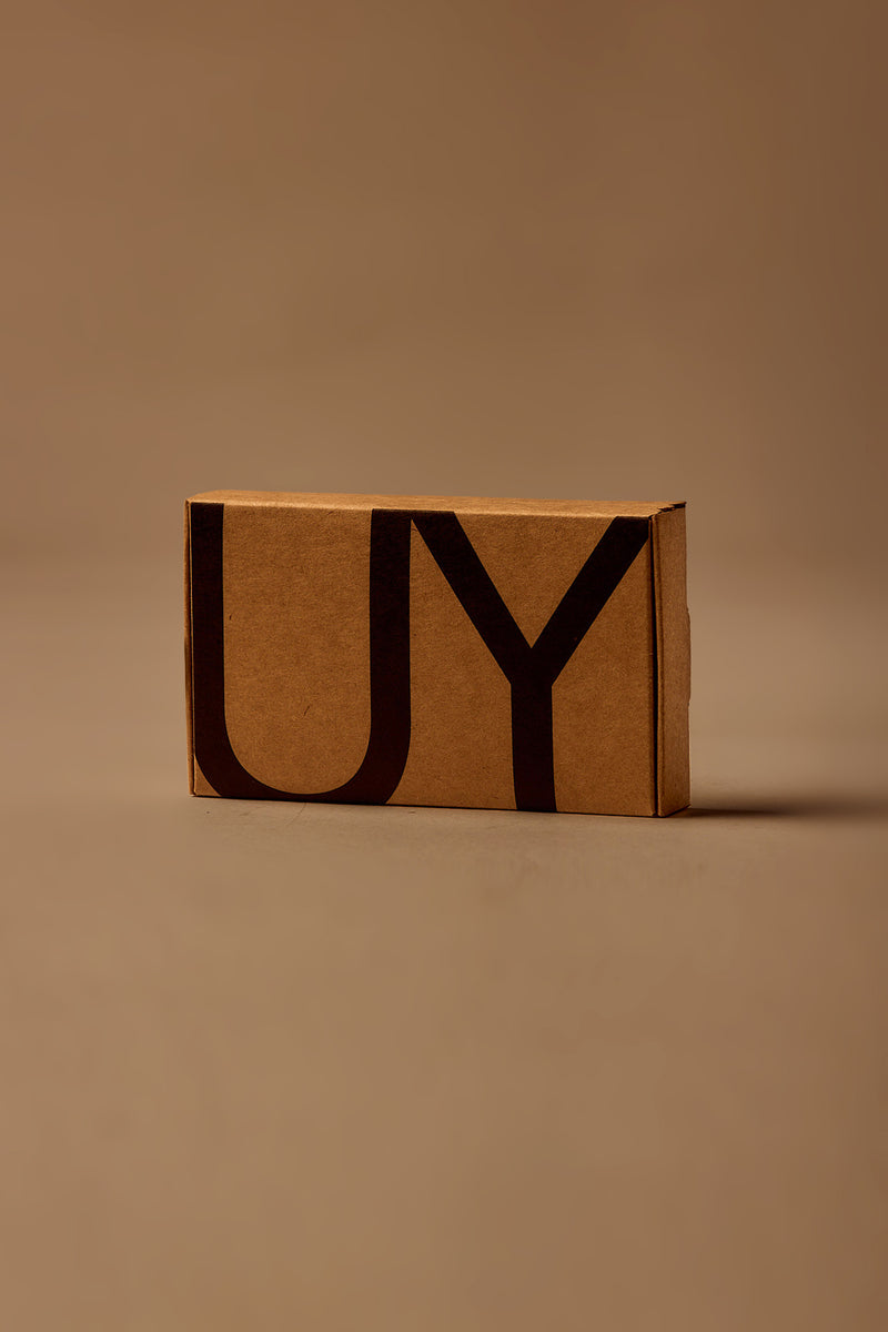 UY Studio discovery box with three 1.5 ml unisex eau de parfum samples from Berlin: U with oud, amber, vanilla and musk; S with bergamot, rose, cardamom, jasmine and amber; T with black tea, rose, cedarwood and musk. A niche fragrance gift set.