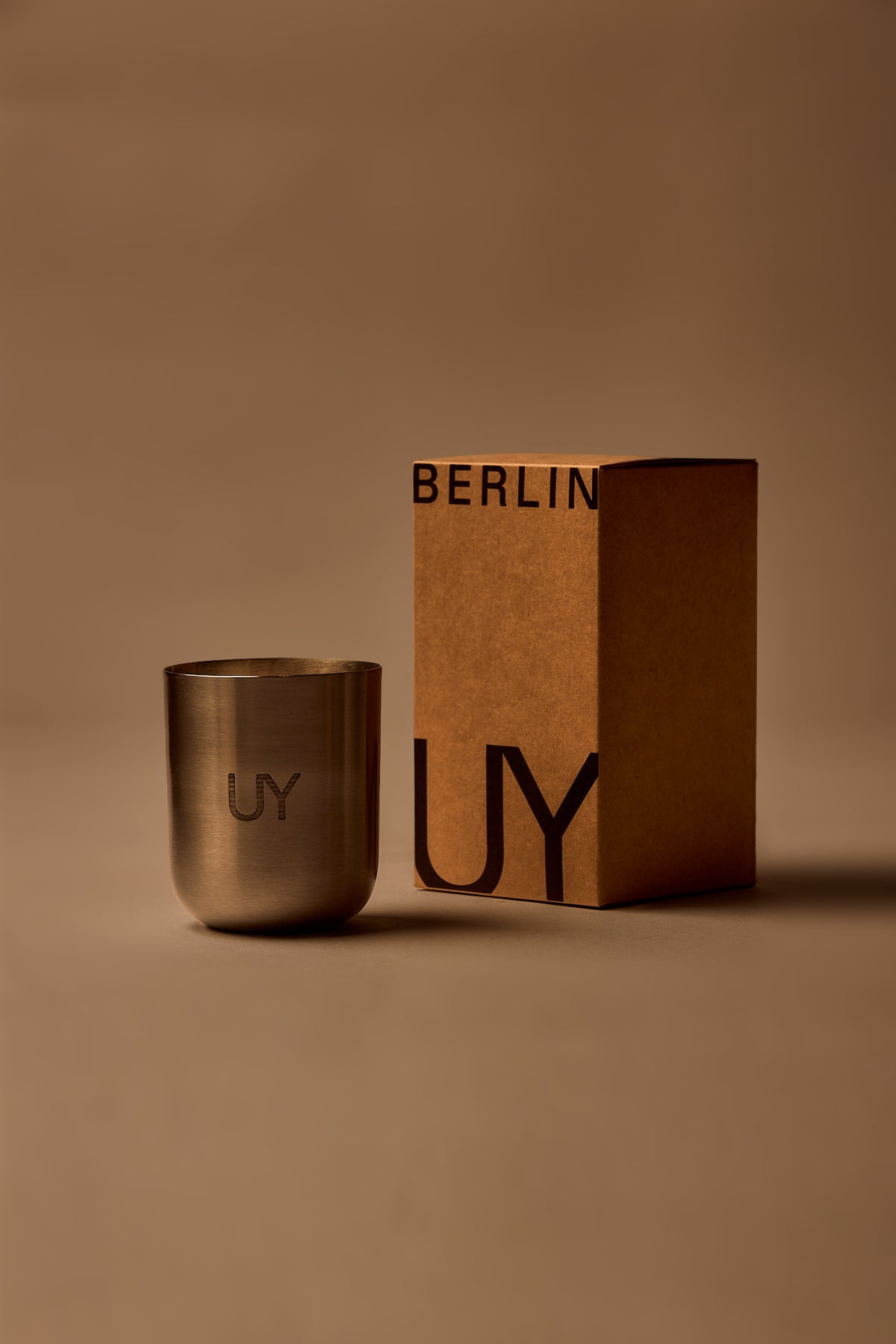 UY Studio X premium scented candle in a steel container, a niche home fragrance from Berlin with notes of patchouli, sandalwood, agarwood and tonka bean.
