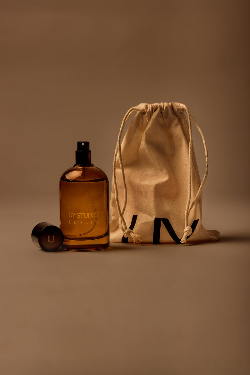 UY Studio U unisex room spray 100 ml amber glass bottle with engraved logo and black cap, oud, amber, vanilla, musk, scent, fragrance