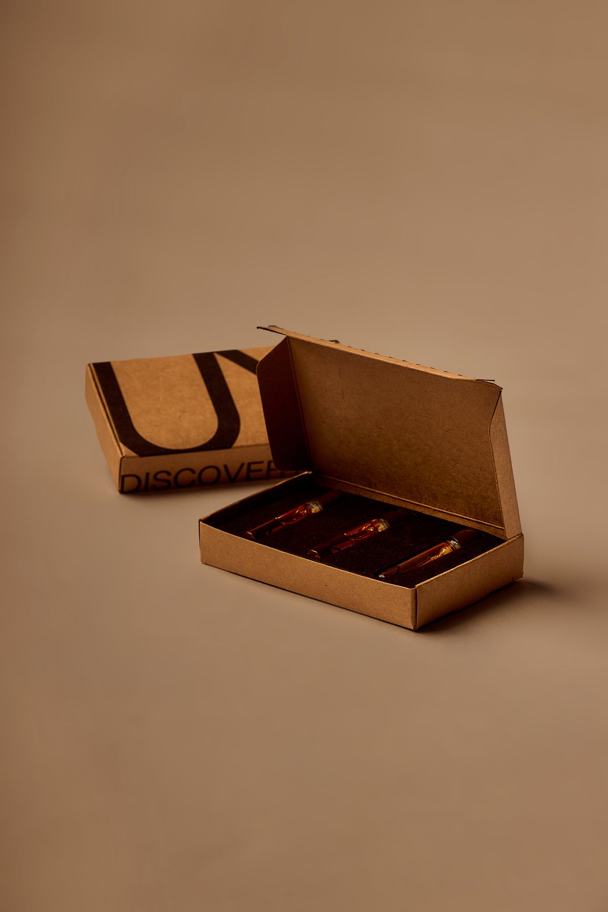 UY Studio Discovery Set with fragrance samples in a kraft cardboard box.